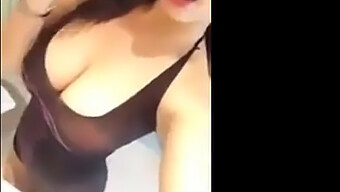 Busty Asian Babe Flaunting Her Assets