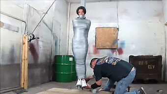 Curvy Woman Restrained With Duct Tape And Sex Toy